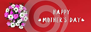 Happy mother`s day background with text inscription, banner on a red with beautiful bouquet of flowers