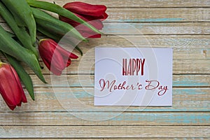 Happy Mother`s Day card with red tulips