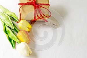 Happy mother`s day concept. Gift box and flower, paper tag