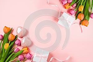 Happy Mother\'s day concept with tulip flowers, heart shape and gift box on pink background. Top view. Flat lay composition