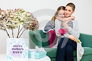 Happy Mother`s Day. Cute little girl congratulating mom to mothers day. Mother and daughter. photo