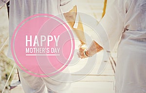 Happy Mother`s day on Girl holding hand crossing the bridge background