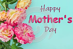 Happy Mother`s Day lettering with pink roses on blue background