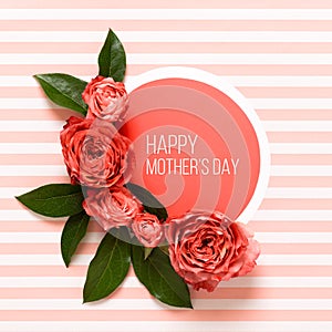 Happy Mother`s Day Living Coral Pantone Color Background. Coral flat lay greeting card with beautiful roses.