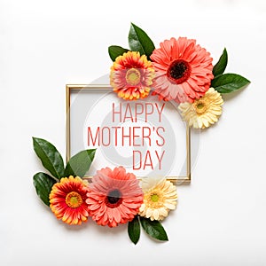 Happy Mother`s Day Living Coral Pantone Color Background. Flat lay greeting card with beautiful coral hue gerbera flowers.