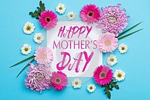 Happy Mother`s Day Pastel Candy blue Colours Background. Floral flat lay.