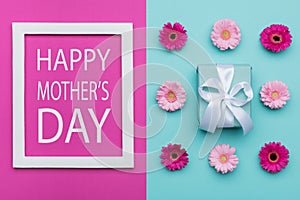 Happy Mother`s Day Pastel Candy Coloured Background. Floral mothers day flat lay