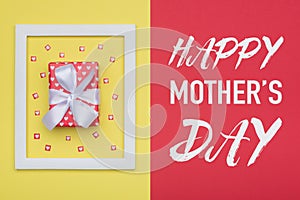 Happy Mother`s Day Pastel Candy Colours Background. Mothers day flat lay minimal concept with beautifully wrapped present