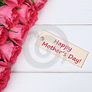 Happy mother's day with roses flowers and greeting card