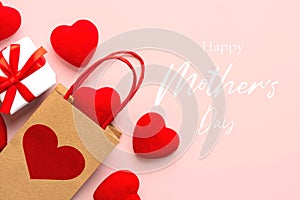 Happy Mother\'s Day. Top view of shopping bag with a red heart,little red hearts and the text Happy Mothers day