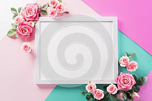 Happy Mother`s Day, Women`s Day or Valentine`s Day greeting concept. Pastel Colours Background with picture frame and pink rese photo