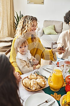 happy mother sitting with daughter and