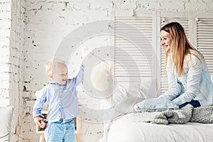 Happy Mother and Son at Home. Mother and Child Hugging