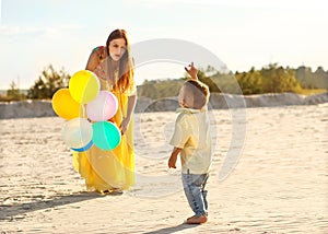 Happy mother and son playing