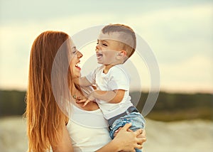 Happy mother and son playing