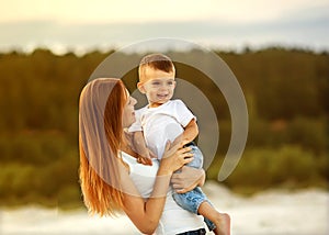 Happy mother and son playing