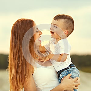 Happy mother and son playing