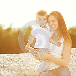 Happy mother and son playing