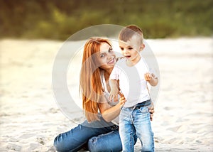 Happy mother and son playing