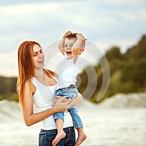 Happy mother and son playing