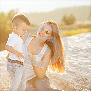 Happy mother and son playing