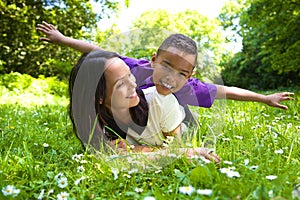 Happy mother and son playing outdoors