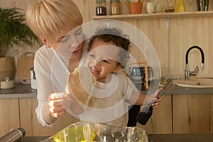 Happy mother and son prepare to eat