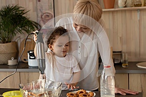 Happy mother and son prepare to eat