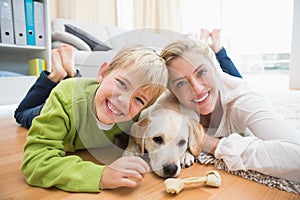 Happy mother and son with puppy