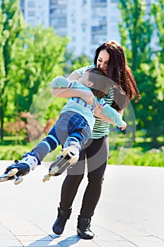 Happy mother twirling her son