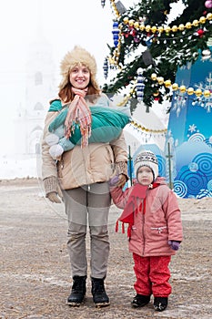 Happy mother with two children in Christmas time