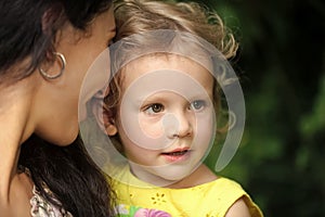 Happy motherhood. Woman hold girl kid on summer day