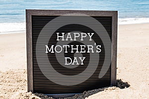 Happy Mothers day beach background with black board