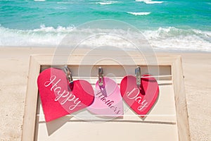 Happy Mothers day beach background with hearts