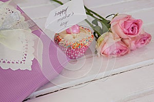 Happy mothers day card with cup cake and gift box