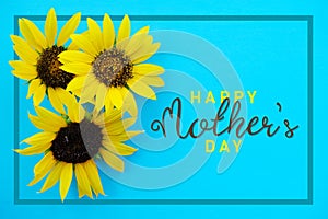 Happy Mothers day card with sunflower on blue background