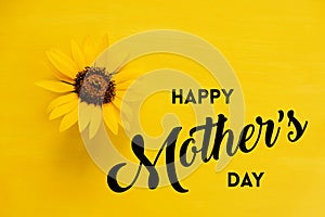 Happy Mothers day card with sunflower on monochrome yellow background.