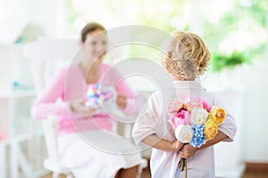 Happy mothers day. Child with present for mom photo