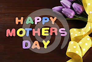 Happy Mothers Day childrens toy block colorful letters spelling greeting photo
