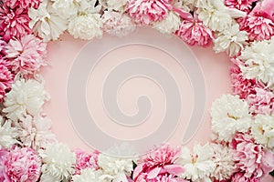 Happy mothers day floral greeting card mockup. Stylish peonies flat lay. Pink and white peonies frame on pastel pink paper with