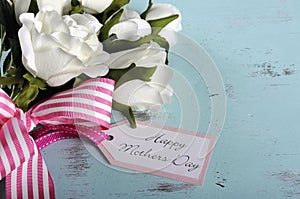 Happy Mothers Day gift of white roses bouquet with copy space