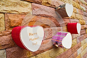 Happy mothers day heart box on brick wall