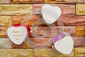 Happy mothers day heart box on brick wall for texture