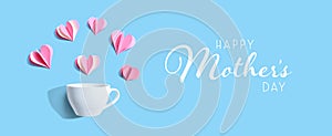 Happy mothers day message with a coffee cup and paper hearts
