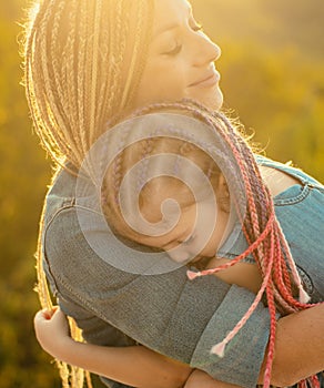 Happy mothers day. Mother and daughter spending time together. Portrait close-up happy smiling mother with her little