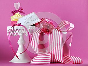 Happy Mothers Day pink heart cupcake on white cupcake stand with gift