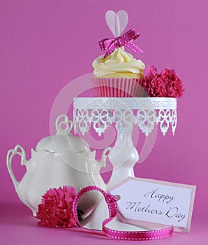 Happy Mothers Day pink heart cupcake on white stand photo