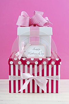 Happy Mothers Day pink and white gift with greeting card.