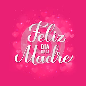 Happy Mothers Day in Spanish. Feliz Dia de la Madre calligraphy hand lettering on pink bokeh background. Vector template