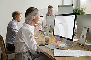 Happy motivated businesswoman reading email excited by good news